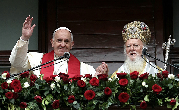 ISTANBUL, TURKEY - NOVEMBER 30: Pope Francis (L) and Ecumenical Patriarch Bartholomew I of Constantinople speak to the faithful after the Divine Liturgy at the Ecumenical Patriarchate on November 30, 2014 in in Istanbul. Pope Francis arrived in Turkey on Friday at a sensitive moment for the Muslim nation as it cares for 1.6 million refugees and weighs up how to deal with the Islamic State group as its fighters grab chunks of Syria and Iraq across Turkey's southern border. (Photo by Gokhan Tan/Getty Images)
